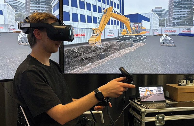 AIT_und_STRABAG_BuildsaVR-test0-mit-bagger-im-AIT-TX-lab.jpg