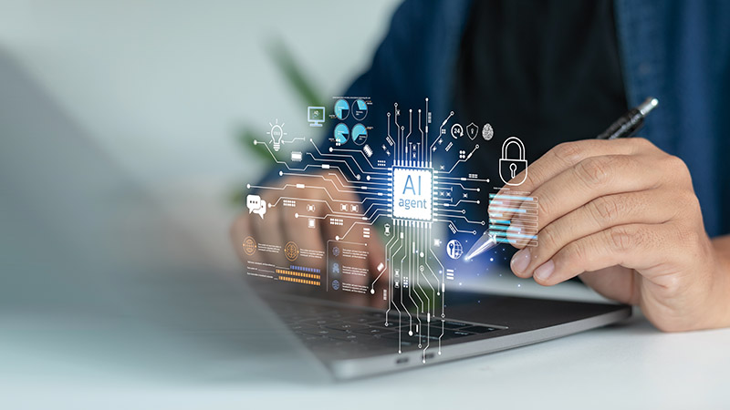 Businessman hand using a laptop with an AI agent technology interface, representing artificial intelligence, data analytics, cybersecurity, and digital transformation.